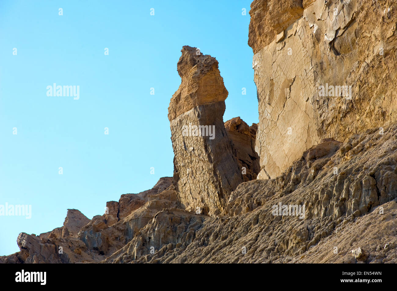 Big rock close to the banks of the dead sea which is called 'Lot's wife' Stock Photo