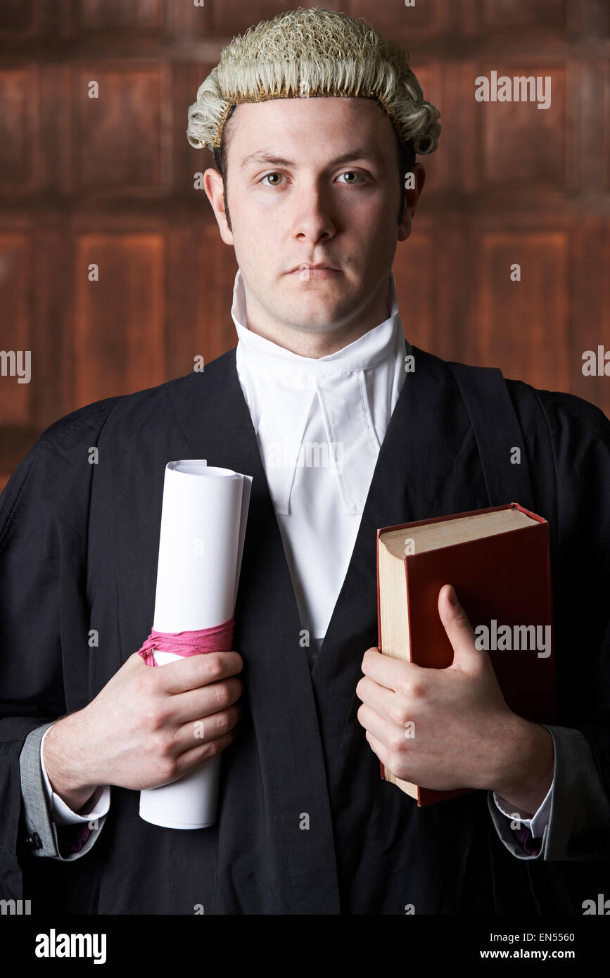Portrait Of Male Lawyer In Court Holding Brief And Book Stock Photo