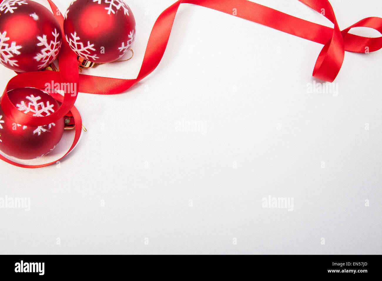 A Christamas balls and a red ribbon on a white background Stock Photo ...