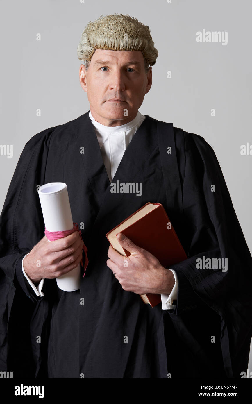Portrait Of Male Lawyer Holding Brief And Book Stock Photo