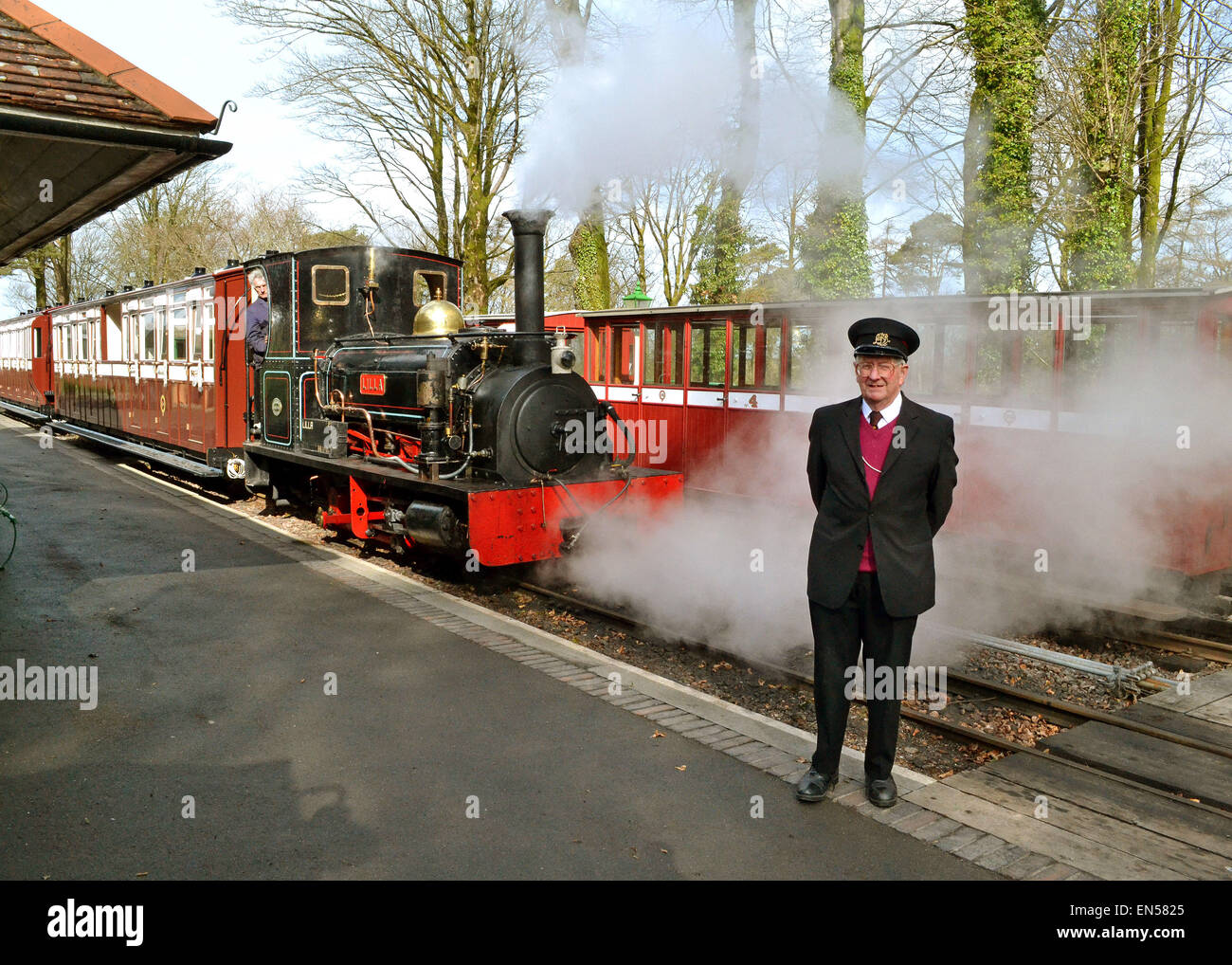 Guard next to Train at Lynton and Barnstaple Railway at Woody Bay Station North Devon England Stock Photo