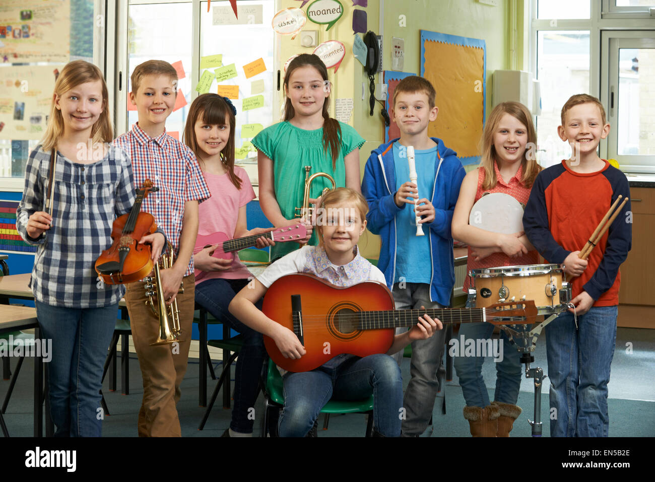 Portrait Of Students Playing In School Orchestra Together Stock Photo