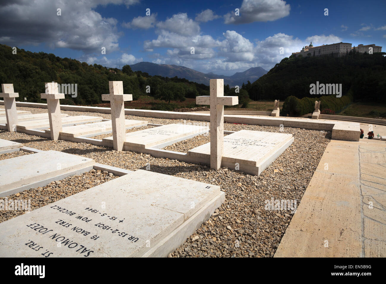Gravestones in the Polish Cemetery standing proud towards the Abbey at Monte Cassino Stock Photo