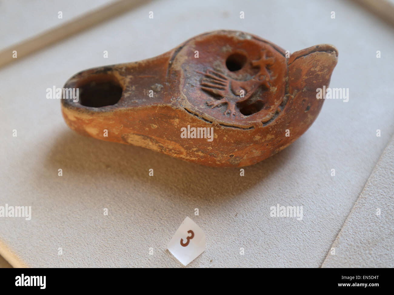 Roman lamp. Early Christian. Symbolism. The Dove with cross. 4th century AD. Vatican Museums. Vatican city. Stock Photo
