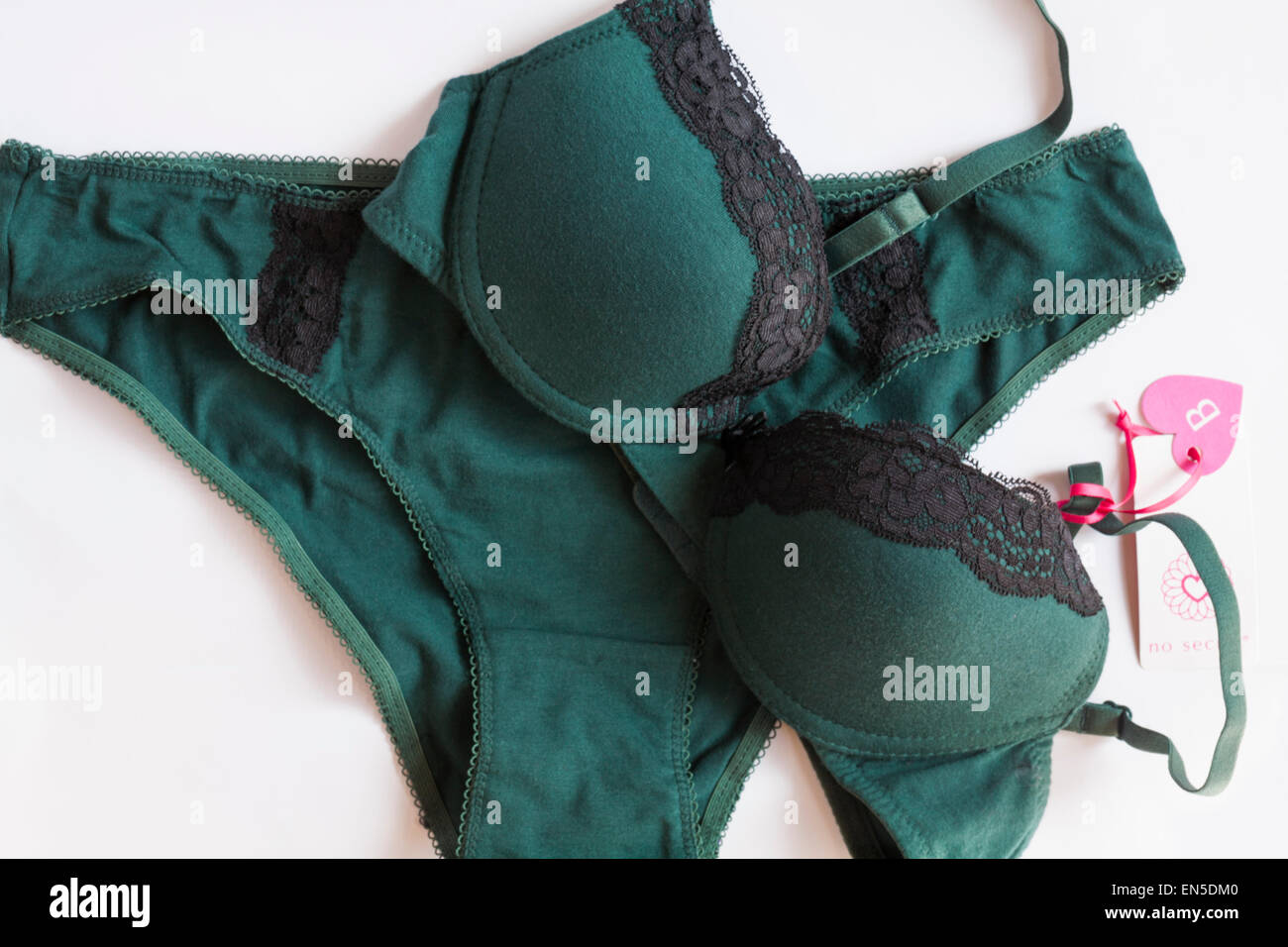 matching No Secret dark green with black lace edged underwear set - bra and  knickers set on white background Stock Photo - Alamy