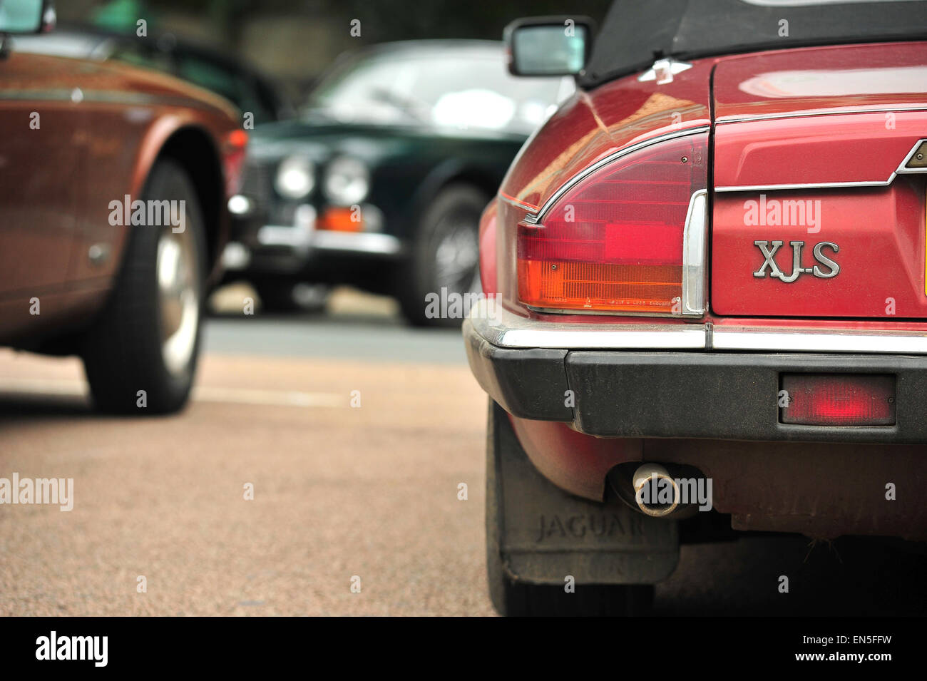 The rear of a Jaguar XJS luxury grand tourer parked on Madeira Drive at the end of the London to Brighton Jaguar Run. Stock Photo