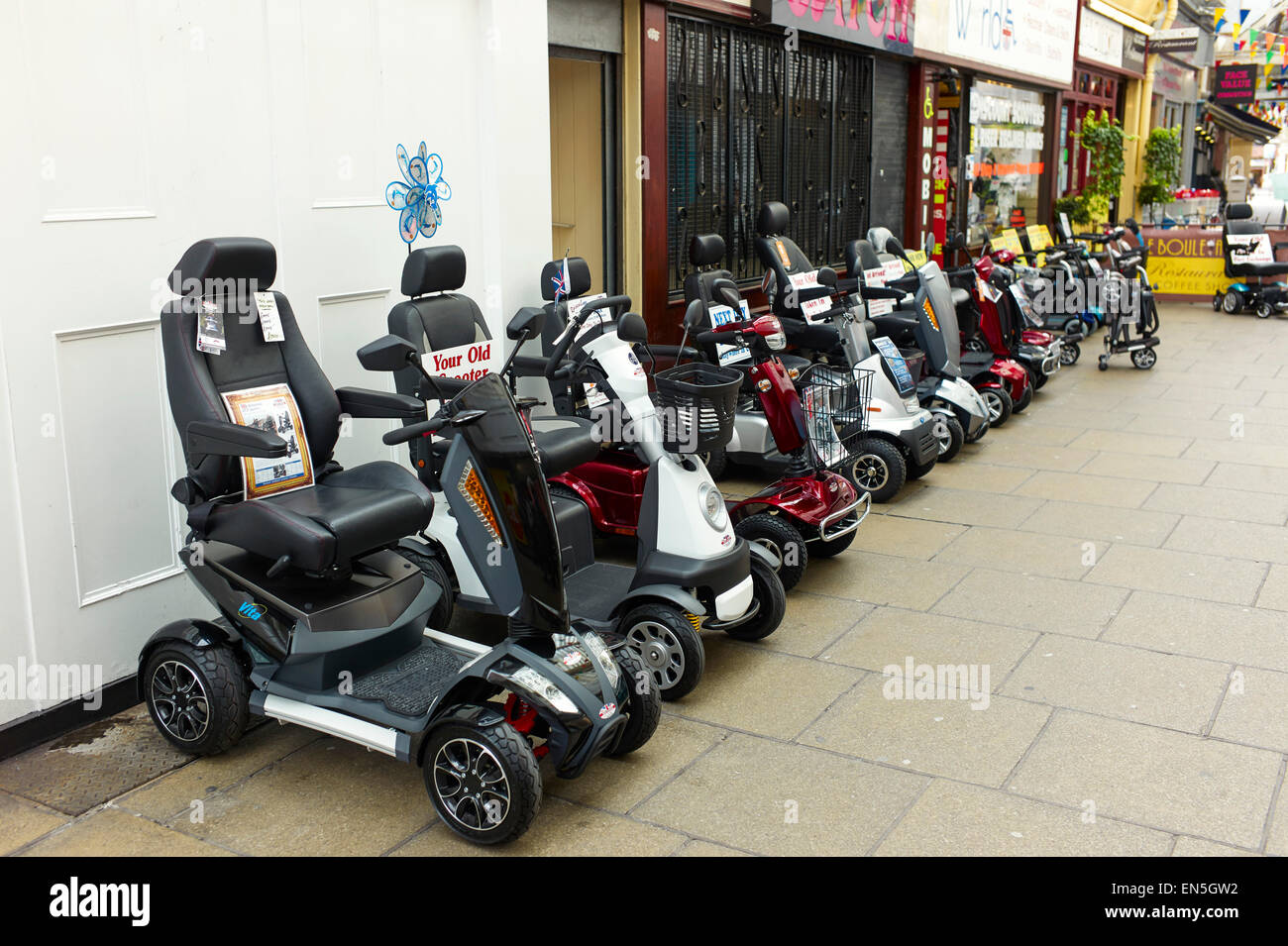 Mobility scooters in a line at Southport Stock Photo