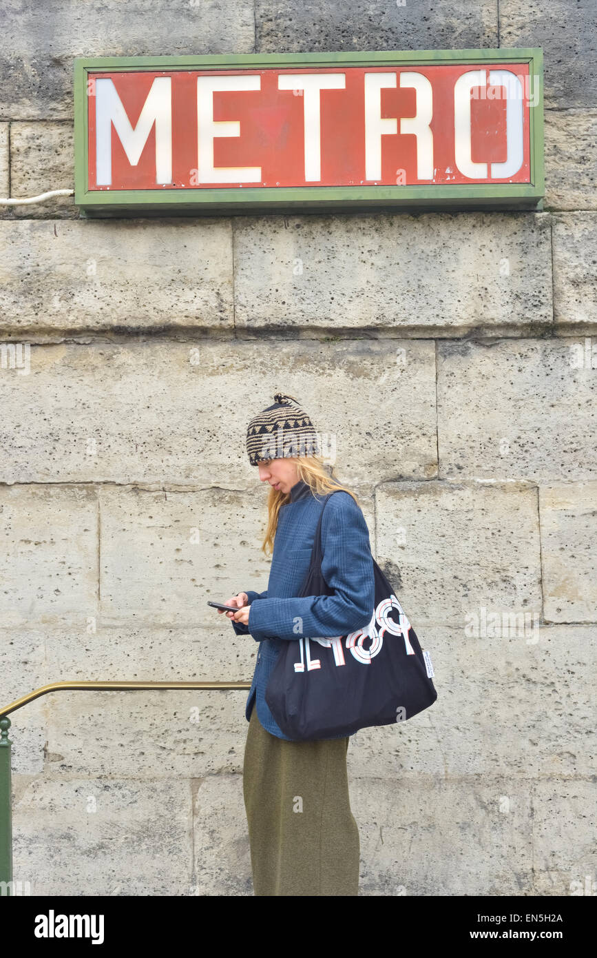 Woman outside the concorde metro station, Paris. Stock Photo