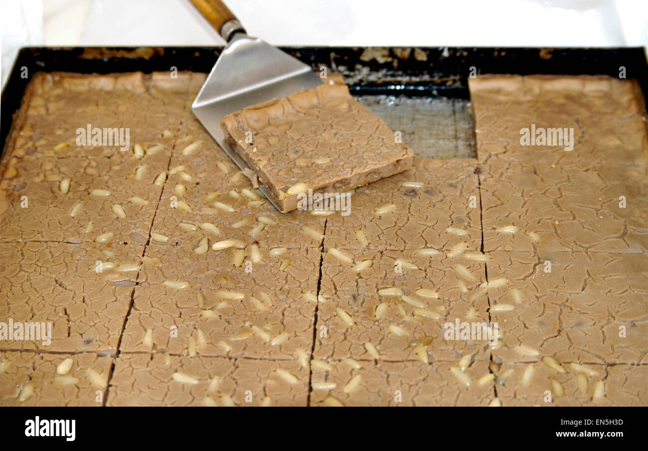 Italian food: a sweet cake made with chestnut flour and pinenuts named castagnaccio Stock Photo