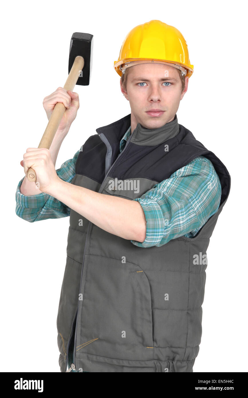 Worker with a sledgehammer Stock Photo Alamy