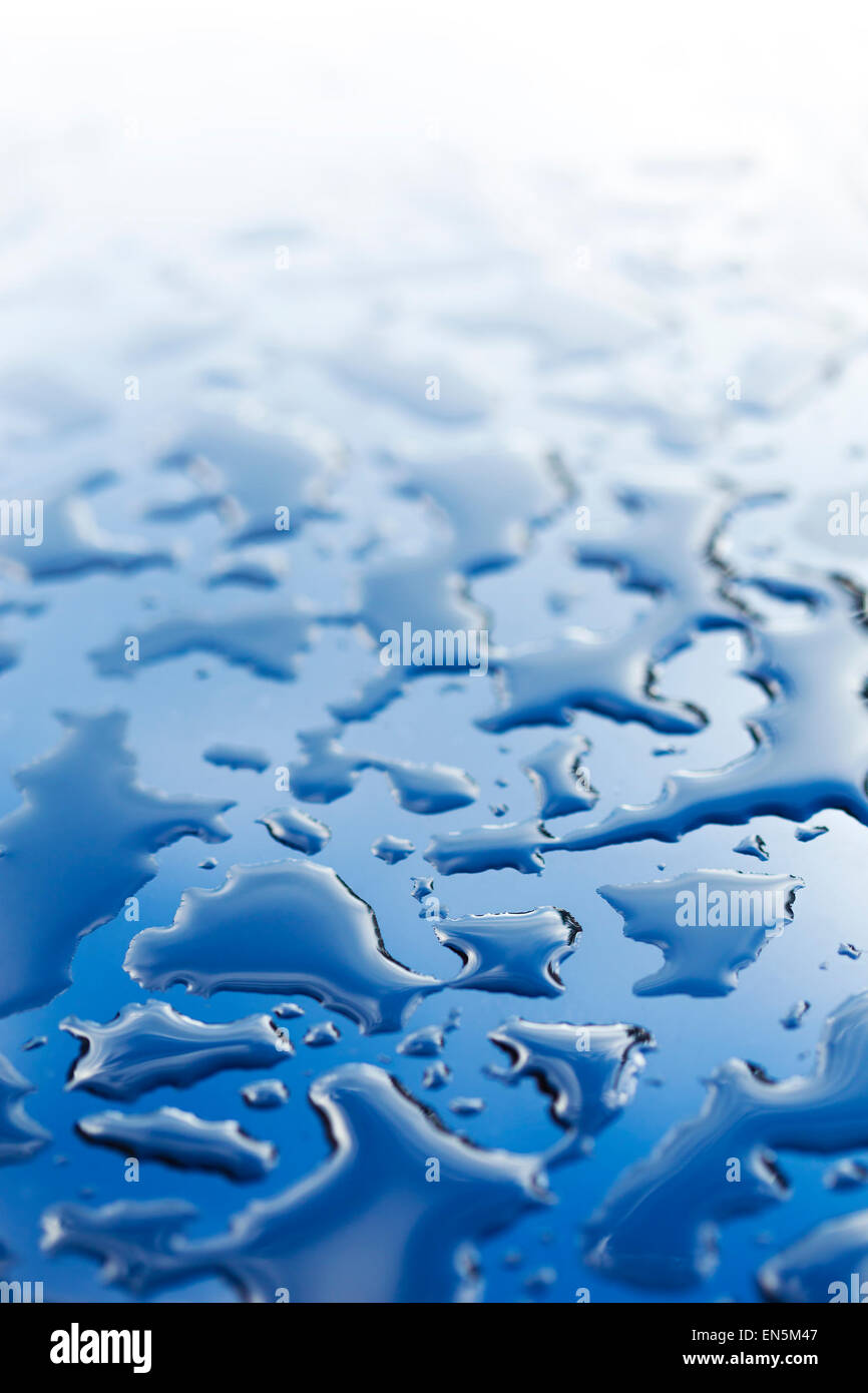 Splattered water drops, on glassy surface. Abstract background Stock Photo