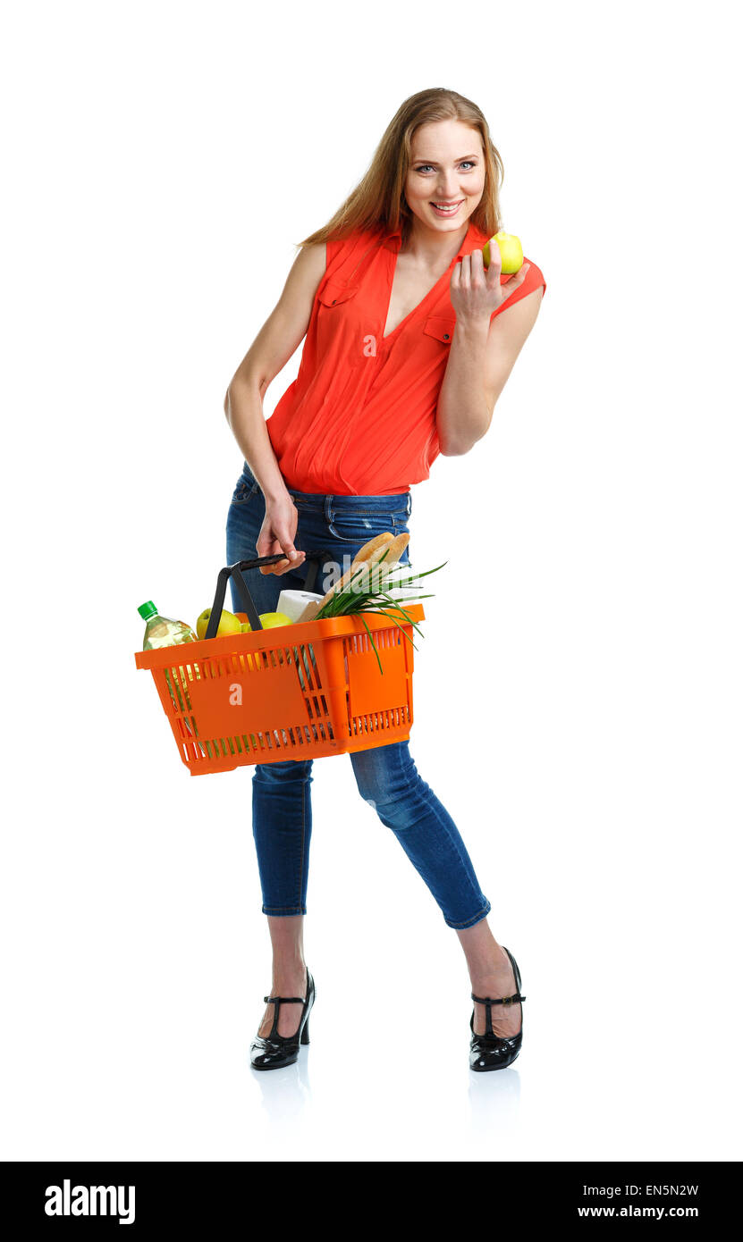 Happy young woman holding a basket full of healthy food. Shopping Stock ...
