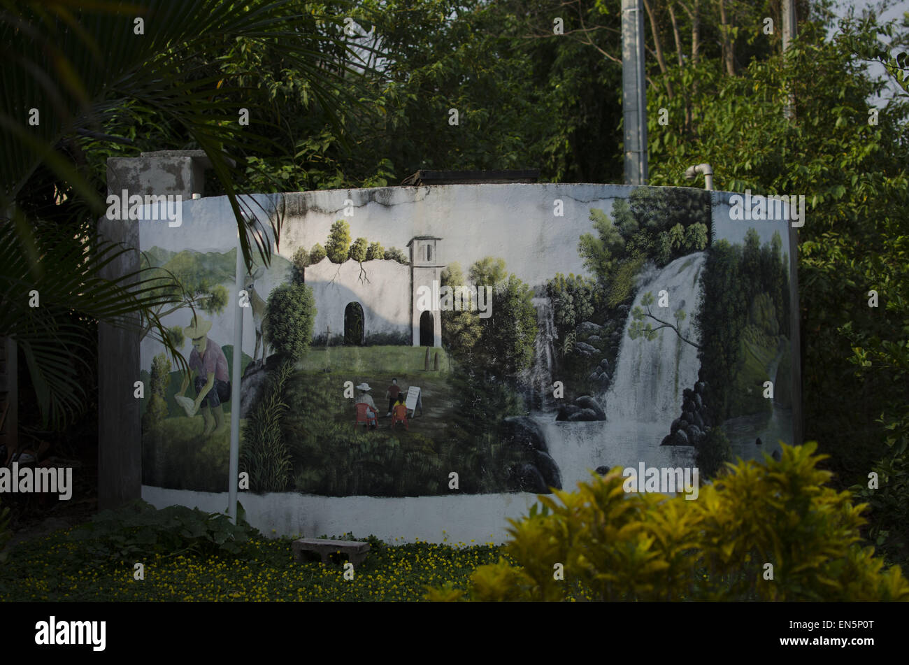 April 24, 2015 - Cinquera, CabaÃ±as, El Salvador - A mural on a water tank in the town of Cinquera, in north central El Salvador, depicts local scenes, including the ruins of the Catholic church as they were left following the Civil War. Largely destroyed during the conflict, the town was repopulated with the peace process by former combatants and survivors who had fled to Honduras as refugees during the 1980s. © ZUMA Wire/ZUMAPRESS.com/Alamy Live News Stock Photo