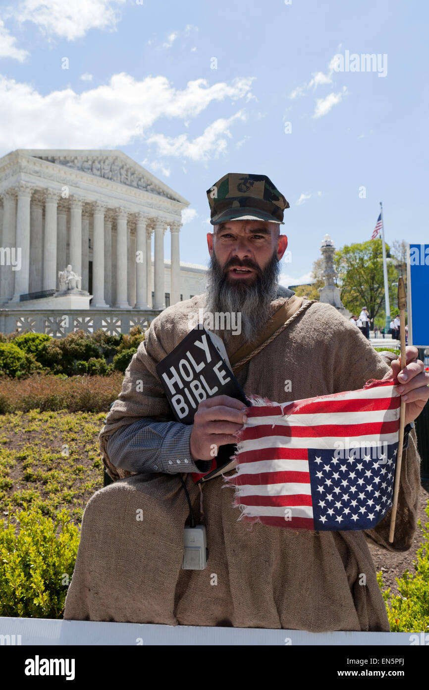 Alan Hoyle carrying a Holy Bible and upside down American Flag in front of The US Supreme Court building - Washington, DC USA Stock Photo