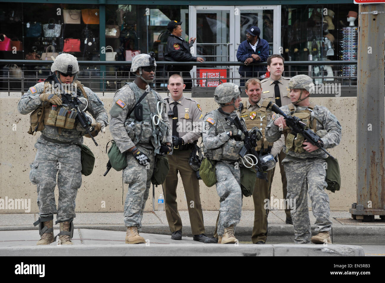 Baltimore, Maryland, USA. 28th Apr, 2015. Members of the National Guard and Maryland state troopers guard Inner Habor, a popular Baltimore tourist area, following rioting. During a night of outrage sparked by the death of 25-year-old Freddie Gray in police custody, the city saw more than a dozen building fires, nearly 200 arrests, and 19 injured police officers. Credit:  Jay Mallin/ZUMA Wire/Alamy Live News Stock Photo