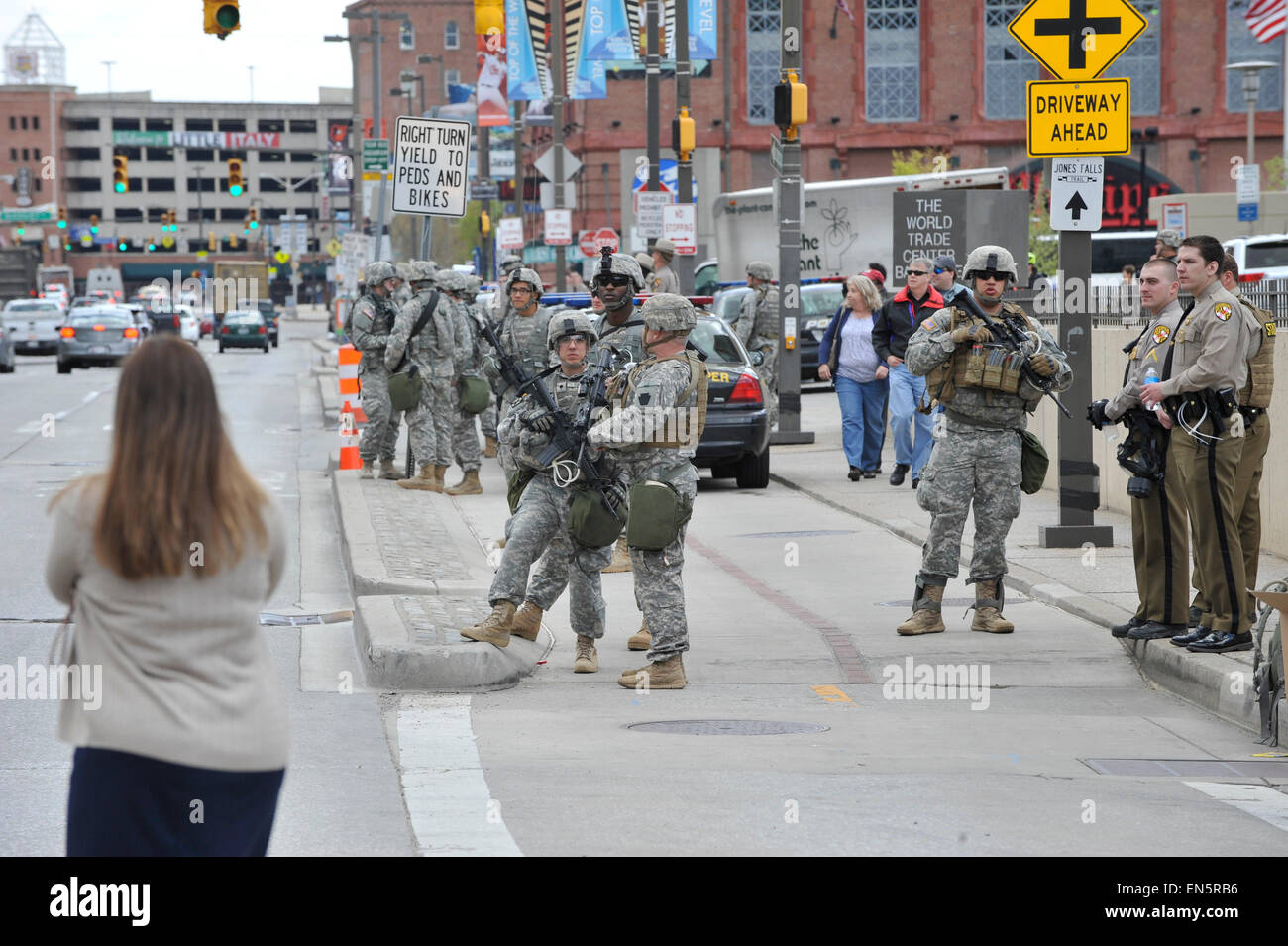 Baltimore, Maryland, USA. 28th Apr, 2015. Members of the National Guard and Maryland state troopers guard Inner Habor, a popular Baltimore tourist area, following rioting. During a night of outrage sparked by the death of 25-year-old Freddie Gray in police custody, the city saw more than a dozen building fires, nearly 200 arrests, and 19 injured police officers. Credit:  Jay Mallin/ZUMA Wire/Alamy Live News Stock Photo