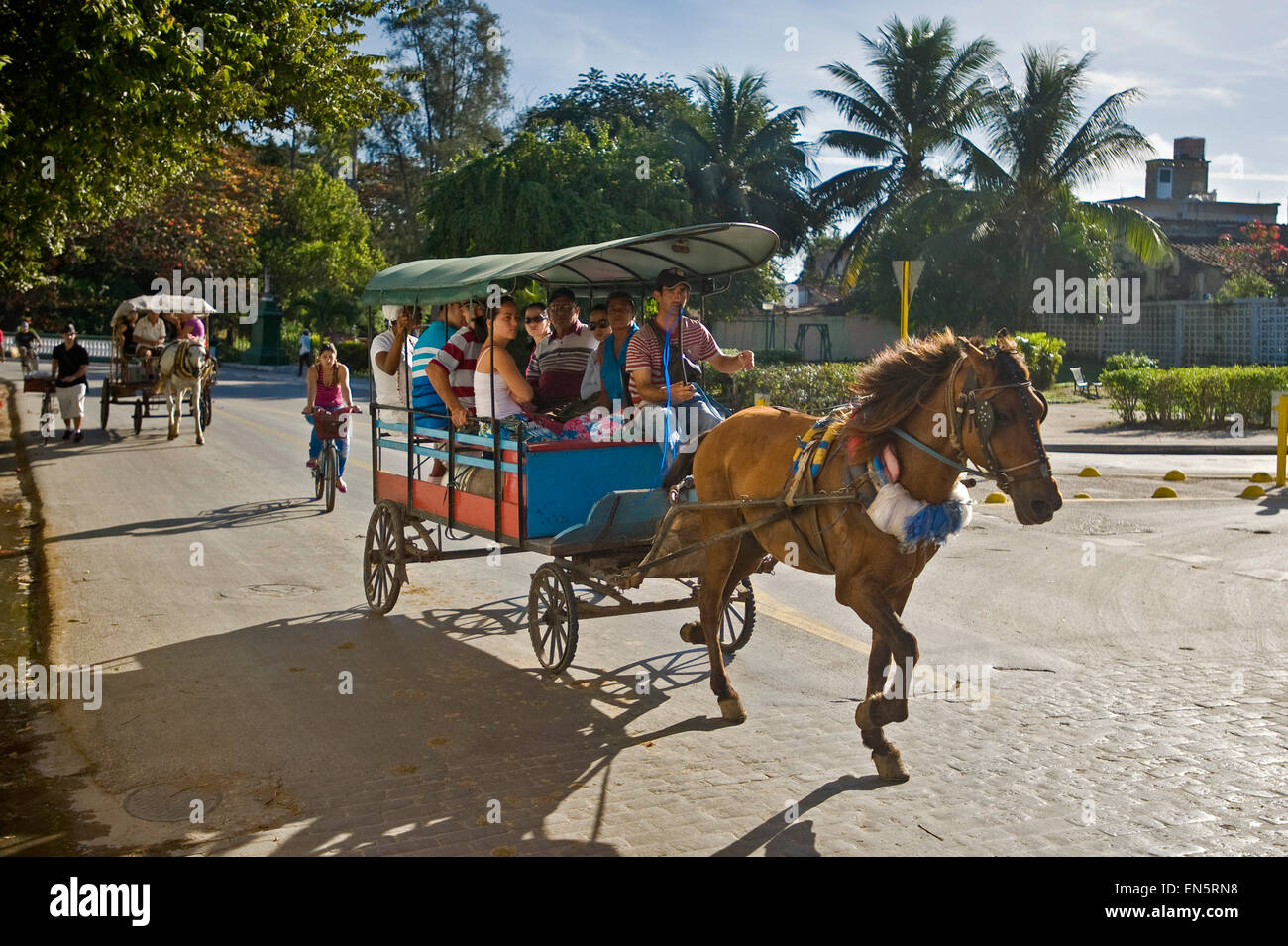 Horizontal view of a pony and trap with passengers in Santa Clara. Stock Photo