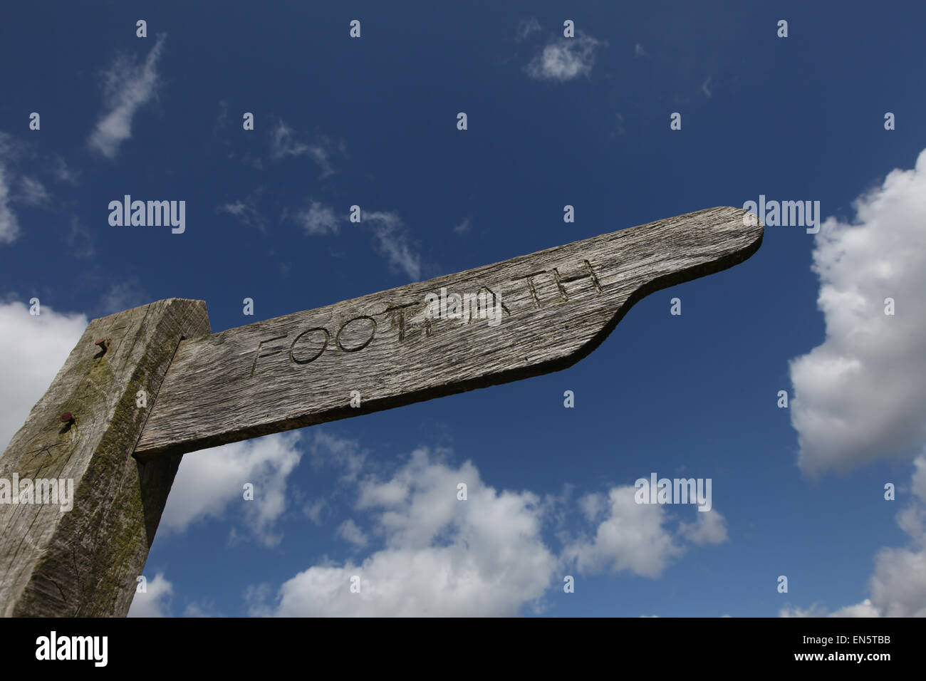 Footpath sign against a cloudy blue sky on the Solent Way in the New Forest UK Stock Photo