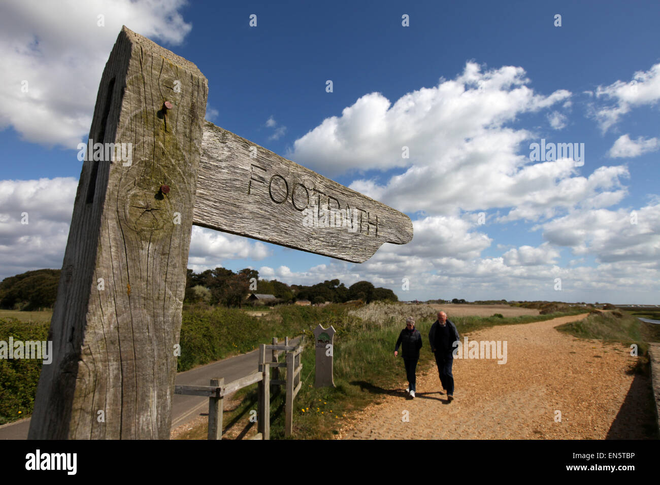 Footpath sign against a cloudy blue sky on the Solent Way in the New Forest UK Stock Photo