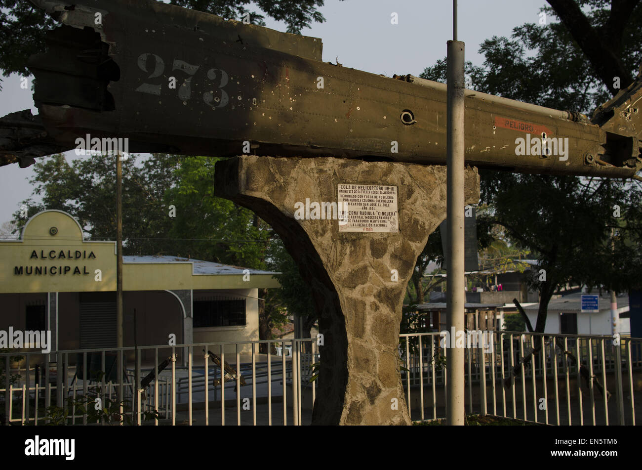 April 24, 2015 - Cinquera, CabaÃ±as, El Salvador - Bullet holes mark the tail of a Bell UH-1H ''Huey'' helicopter adorning the central plaza in the town of Cinquera, in north central El Salvador. According to the plaque, the helicopter was ''Shot down with rifle fire by a heroic guerilla column in the hamlet of San José el Tule'' in 1991. Largely destroyed during the Civil War, the town of Cinquera was repopulated with the peace process by former combatants and survivors who had fled to Honduras as refugees during the 1980s. © ZUMA Wire/ZUMAPRESS.com/Alamy Live News Stock Photo