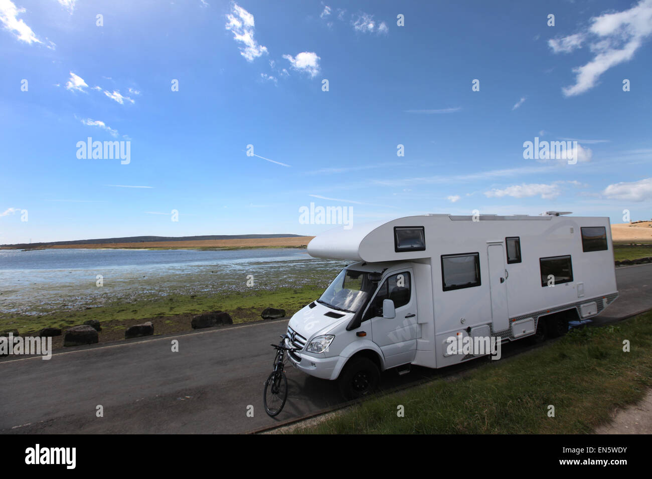 A camper van pictured in a beauty spot in Keyhaven, The New Forest, Hampshire, UK Stock Photo