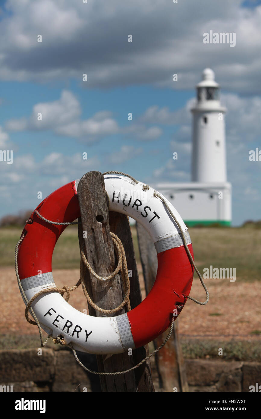 Hurst Ferry life ring with Hurst Point Lighthouse in the background at Hurst Spit Keyhaven, New Forest, Hampshire, UK Stock Photo