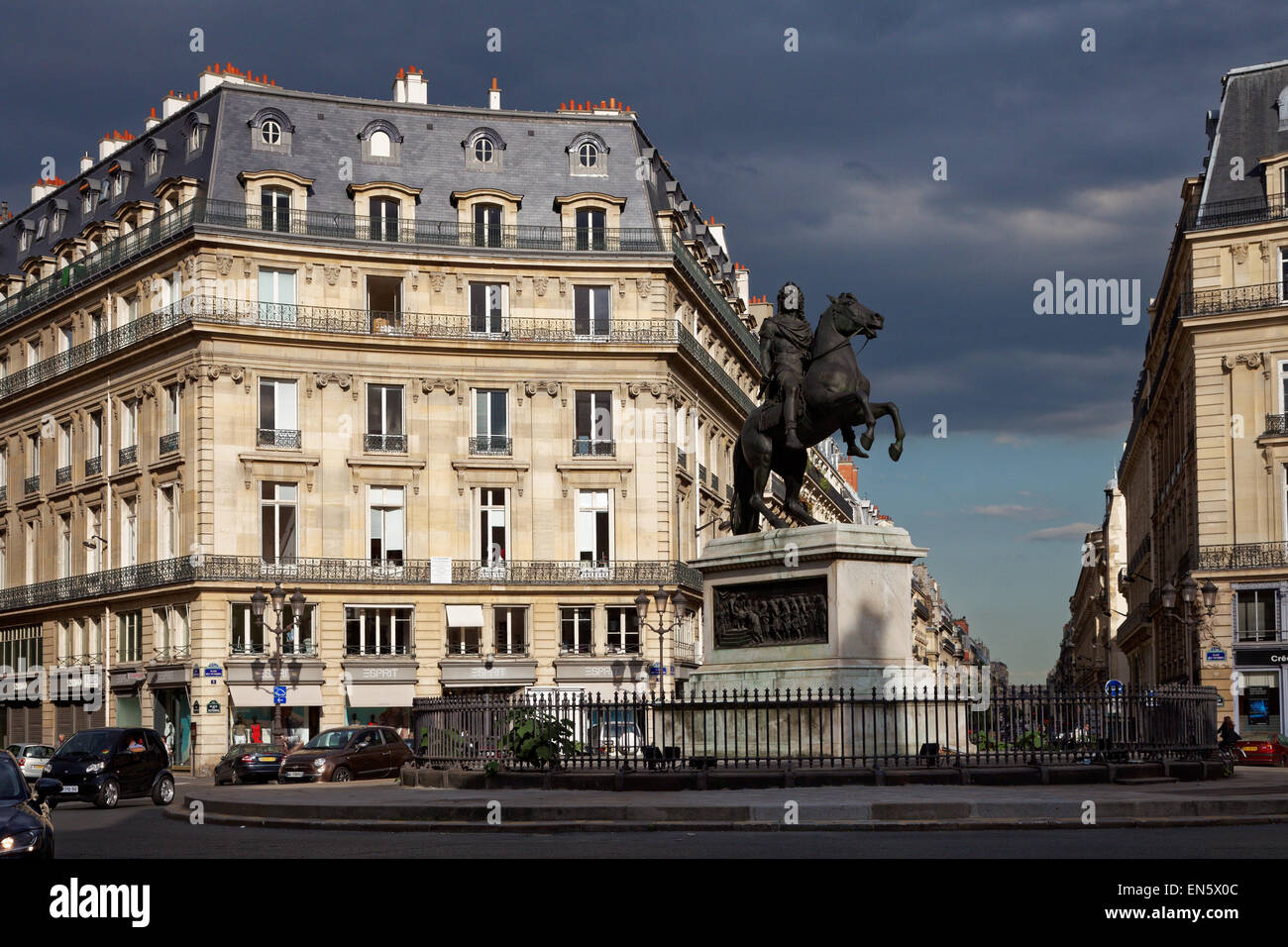 Paris Place des Victoires original statue, of Louis XIV crowned by Fame street Stock Photo
