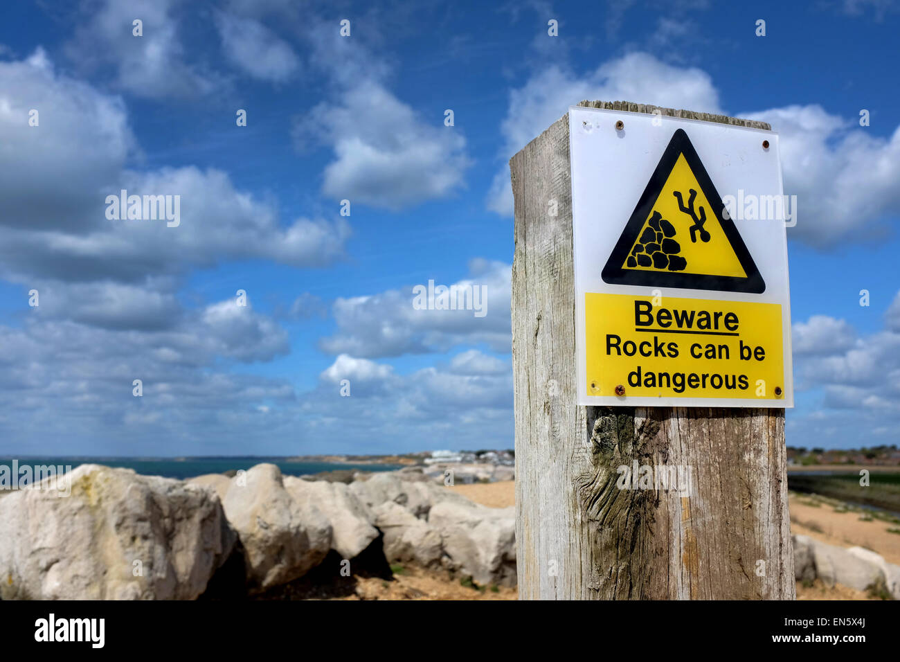 Rocks can be dangerous warning sign Stock Photo