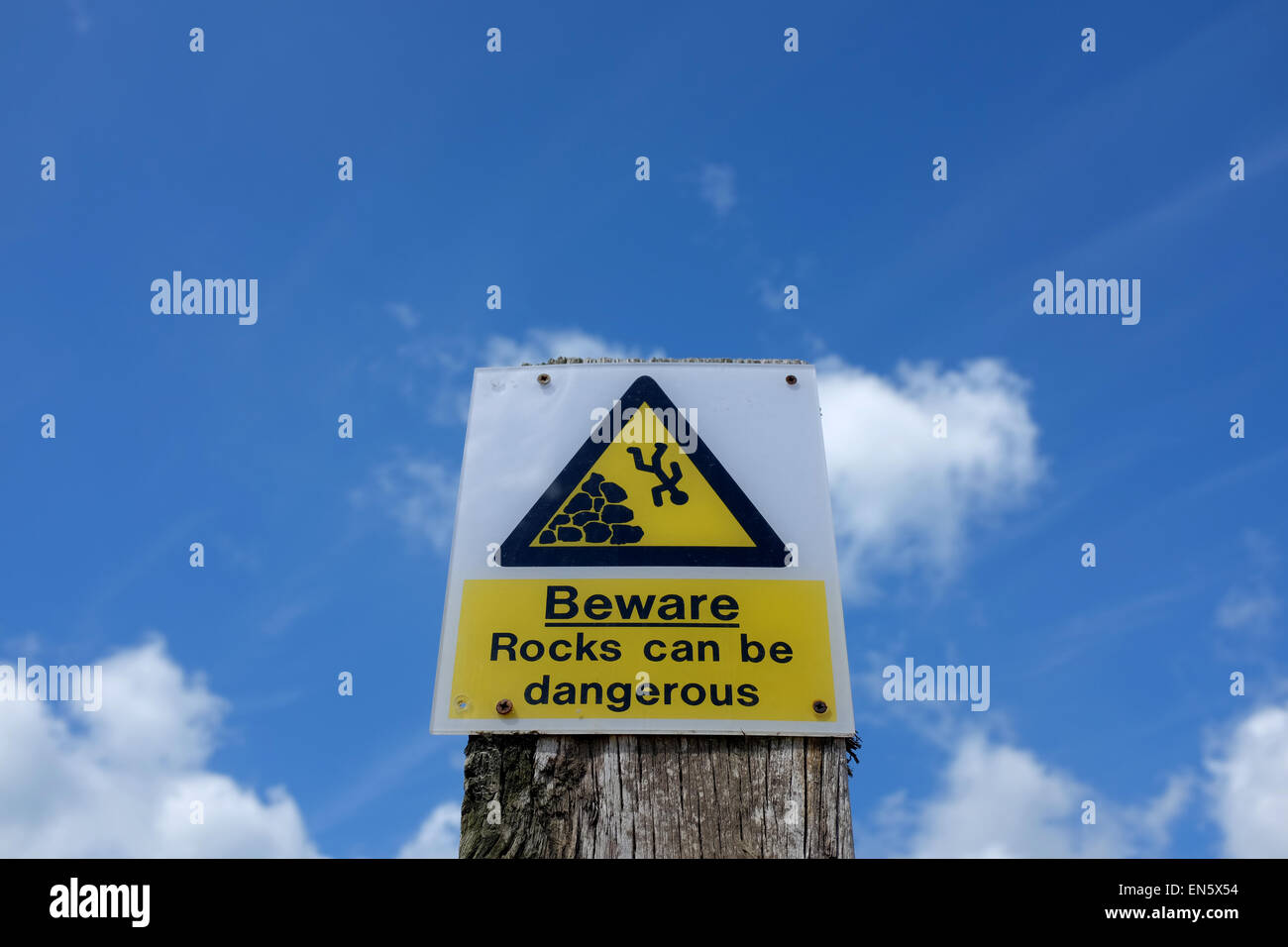 Rocks can be dangerous warning sign Stock Photo