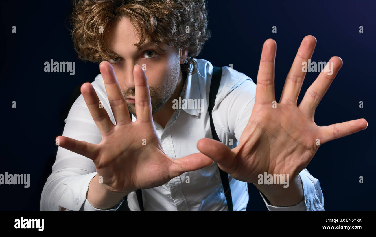 https://c8.alamy.com/comp/EN5YRK/image-of-a-man-who-performs-magic-with-his-hands-EN5YRK.jpg