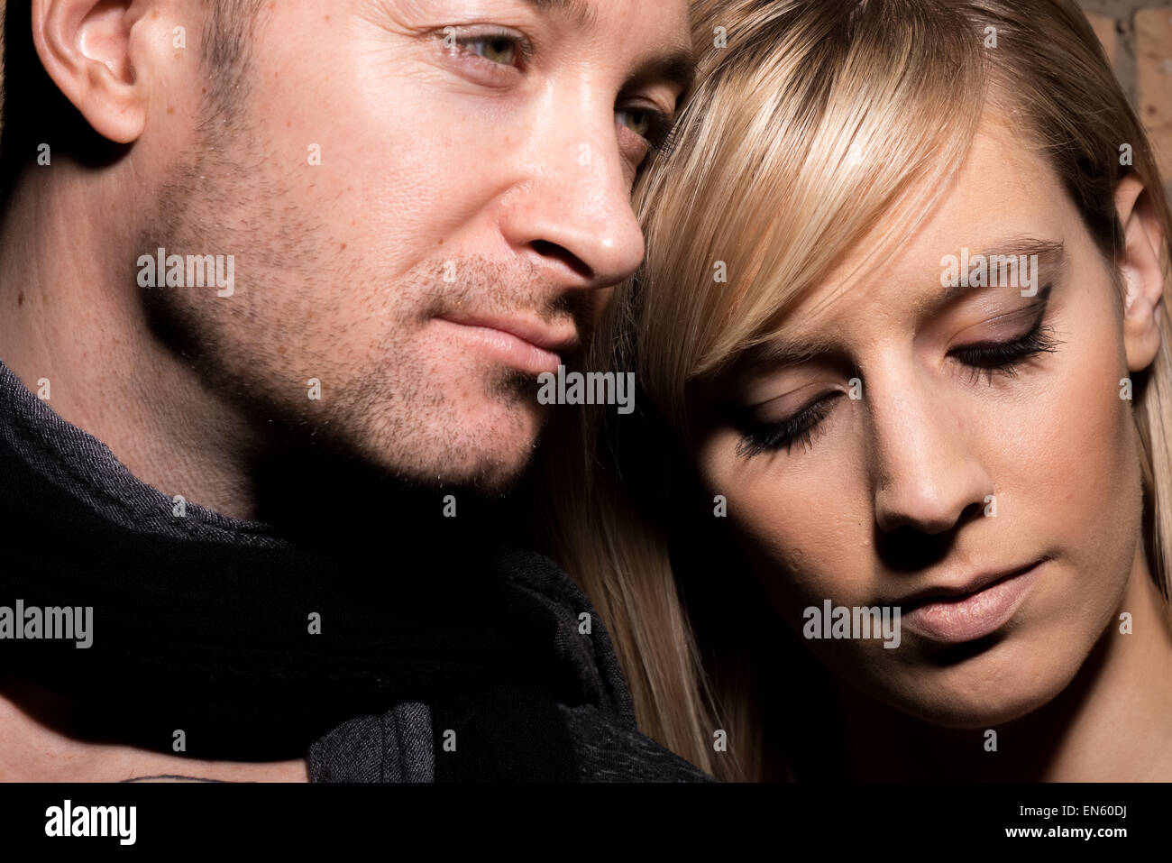Portrait of man and woman in relationship in high contrast tight image Stock Photo
