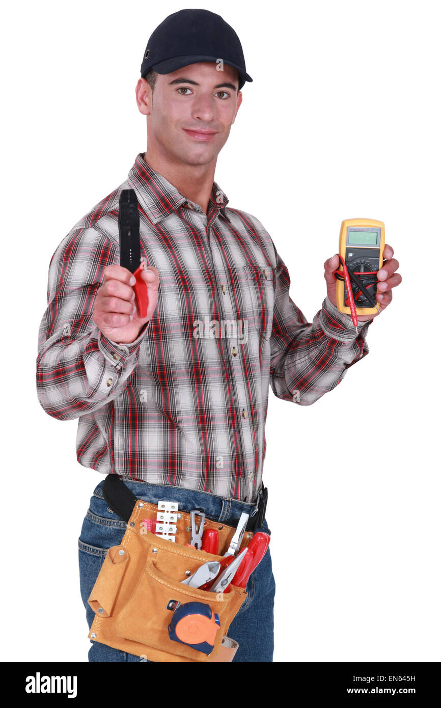 Craftsman with tweezers and voltmeter Stock Photo Alamy