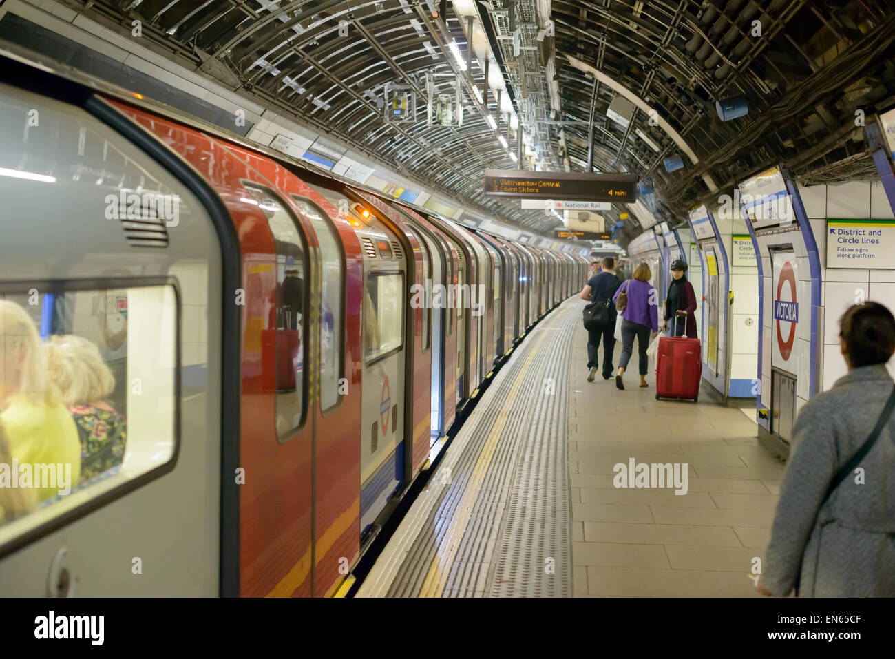 Train about to depart from a station on the Victoria Line of London's Underground, otherwise known as The Tube. UK public transport; transportation. Stock Photo