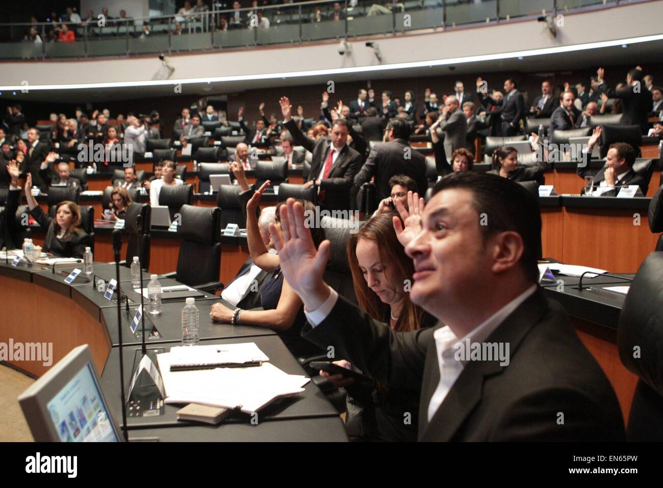 Mexico City, Mexico. 28th Apr, 2015. Senators take part in the vote of the political reform of the Federal District at the headquarters of the Republic's Senate, in Mexico City, capital of Mexico, on April 28, 2015. According to local press, the Senate approved the political reform of the Federal District, which among its most important highlights is that Mexico City will be provided with a local Congress and its own Constitution. Credit:  NOTIMEX/Xinhua/Alamy Live News Stock Photo