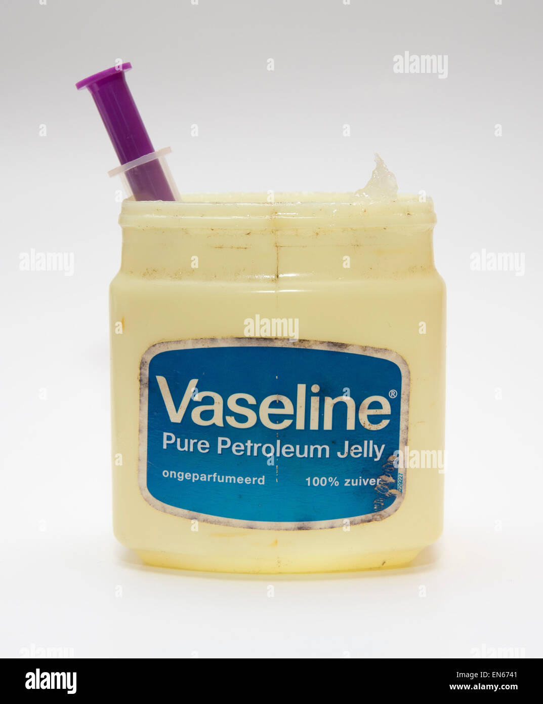 tub of Vaseline petroleum jelly containing a syringe, isolated on white  background Stock Photo - Alamy