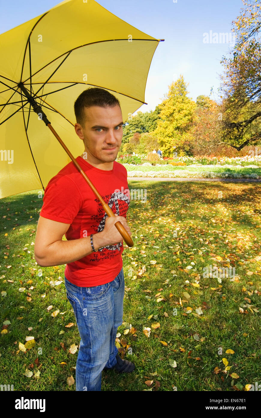 Funny guy yellow umbrella hi-res stock photography and images - Alamy