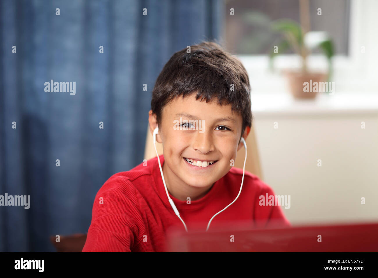 Young boy doing his homework on a computer - with shallow depth of field Stock Photo