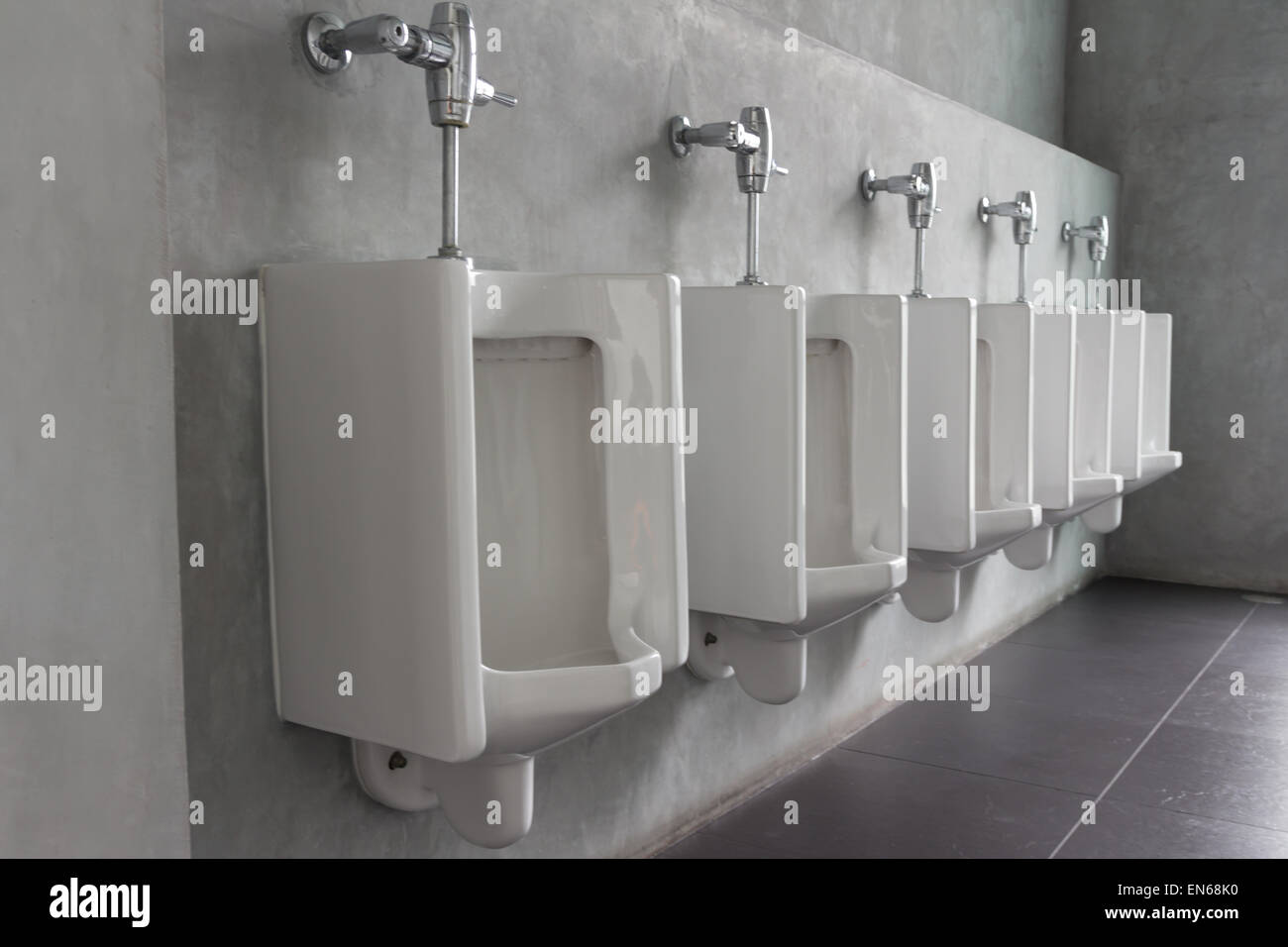 public restroom - urinals in a row Stock Photo