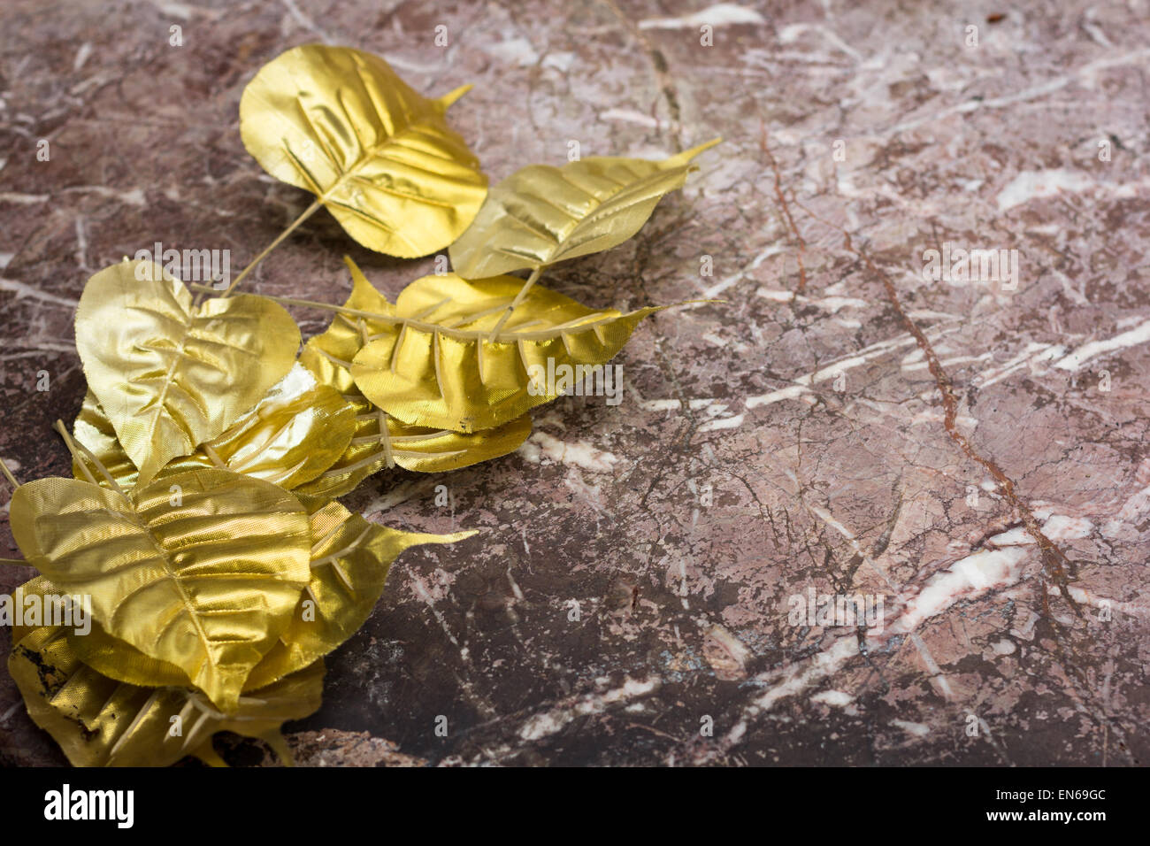 Gold leaf on marble background Stock Photo
