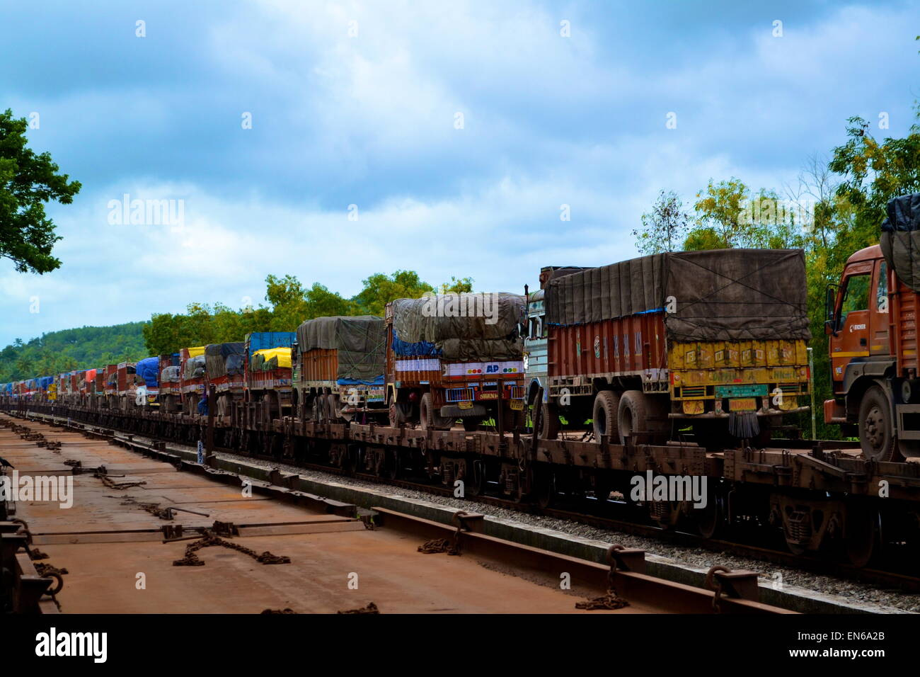 Colourful Trucks on Train, India Stock Photo