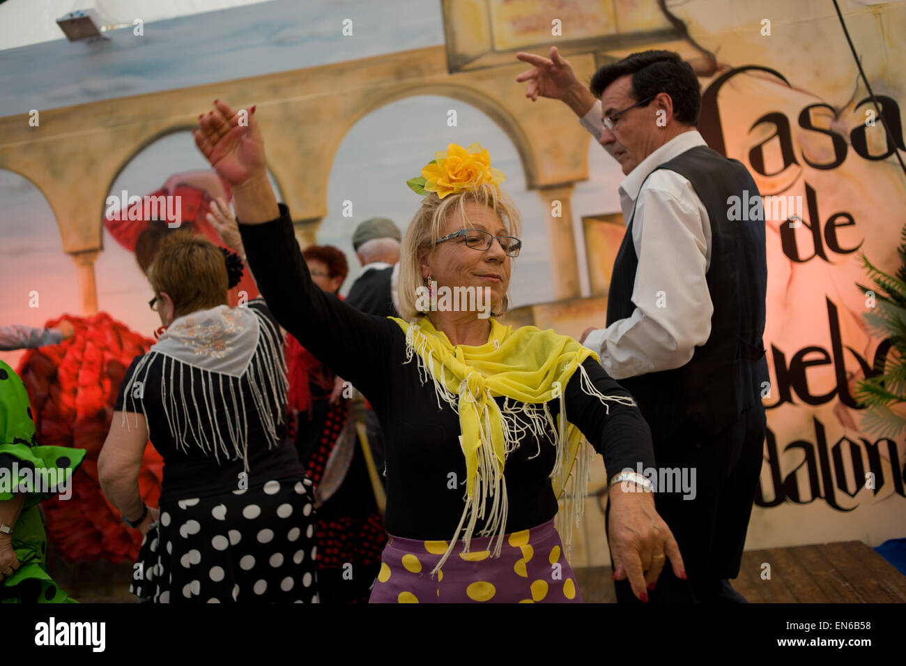 A woman dancing Sevillanas (Typical Andalusian dance) during la Feria de Abril in Barcelona. Stock Photo