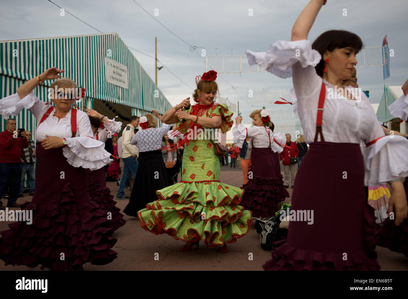 Women dancing Sevillanas (Typical Andalusian dance) during la Feria de Abril in Barcelona. Stock Photo