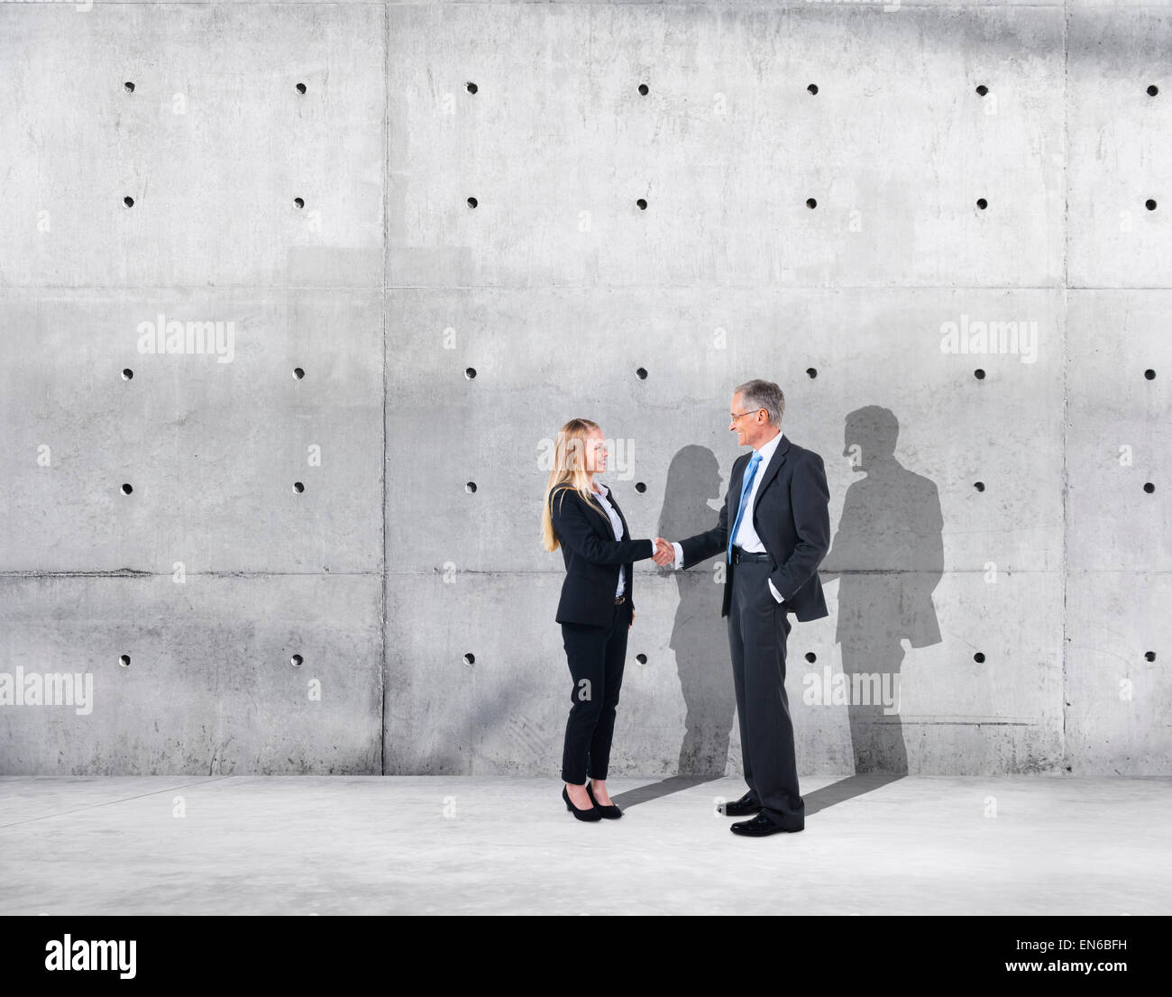 Business Handshake on an Industrial Building Stock Photo