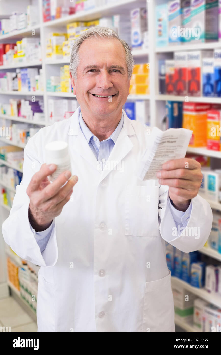 Senior holding medicine box and prescription Stock Photo