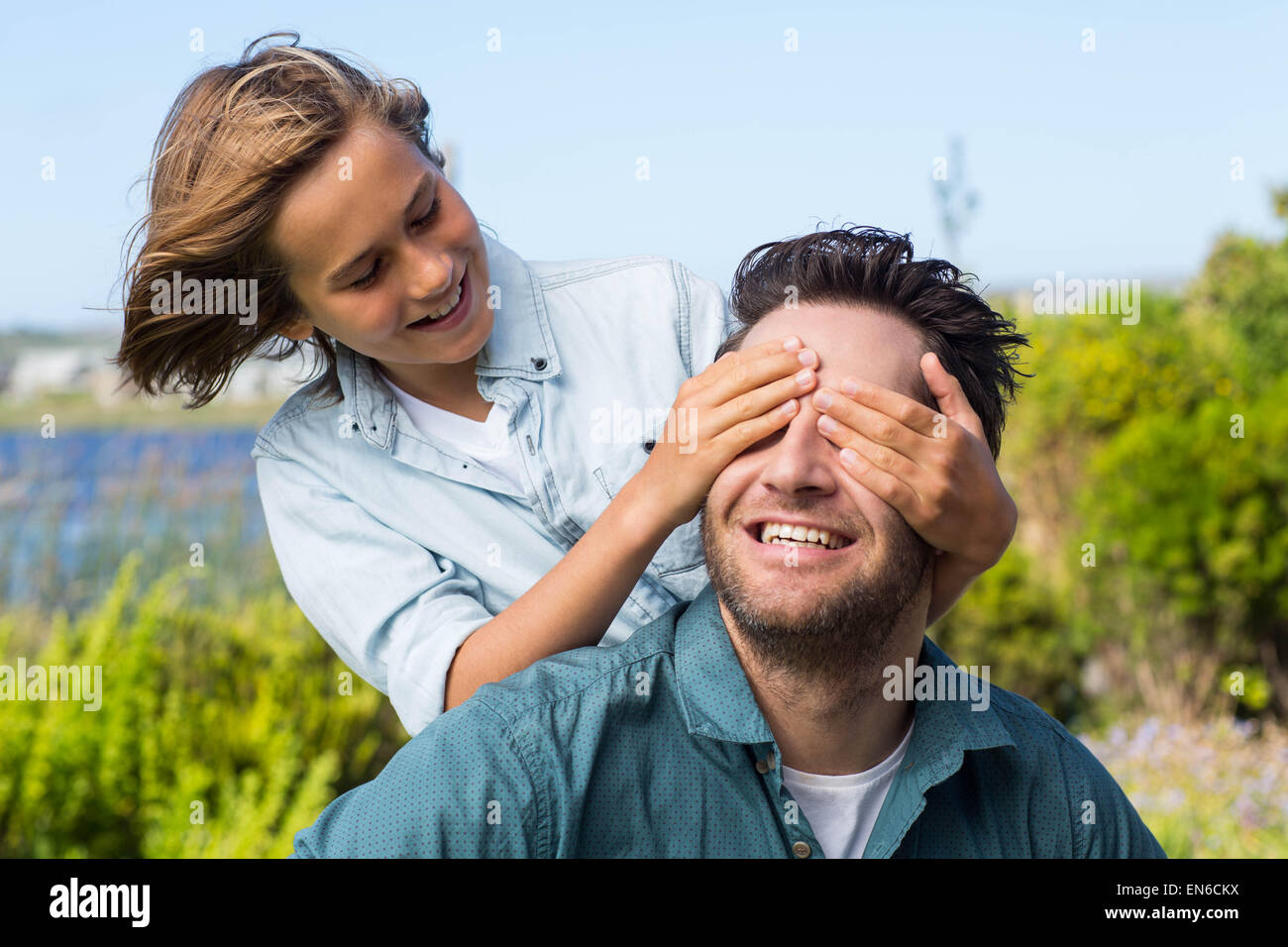 Son covering father eyes hi-res stock photography and images - Alamy