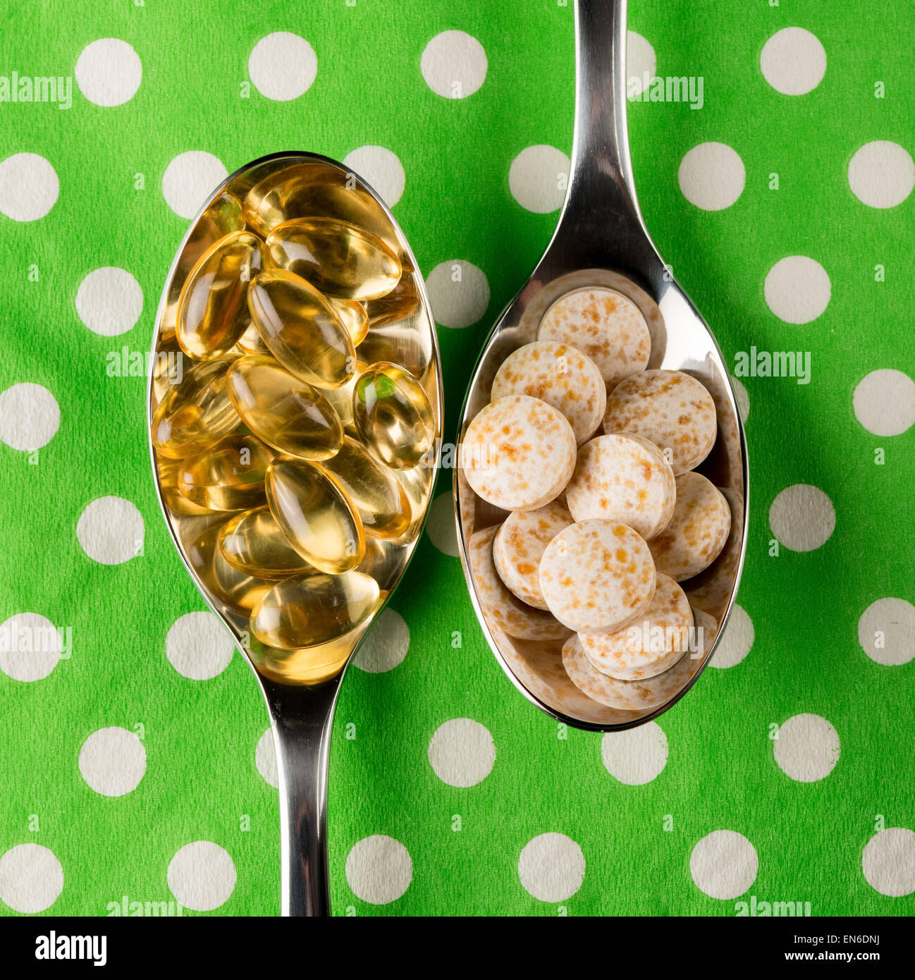 Spoons containing  vitamins including D and E Stock Photo