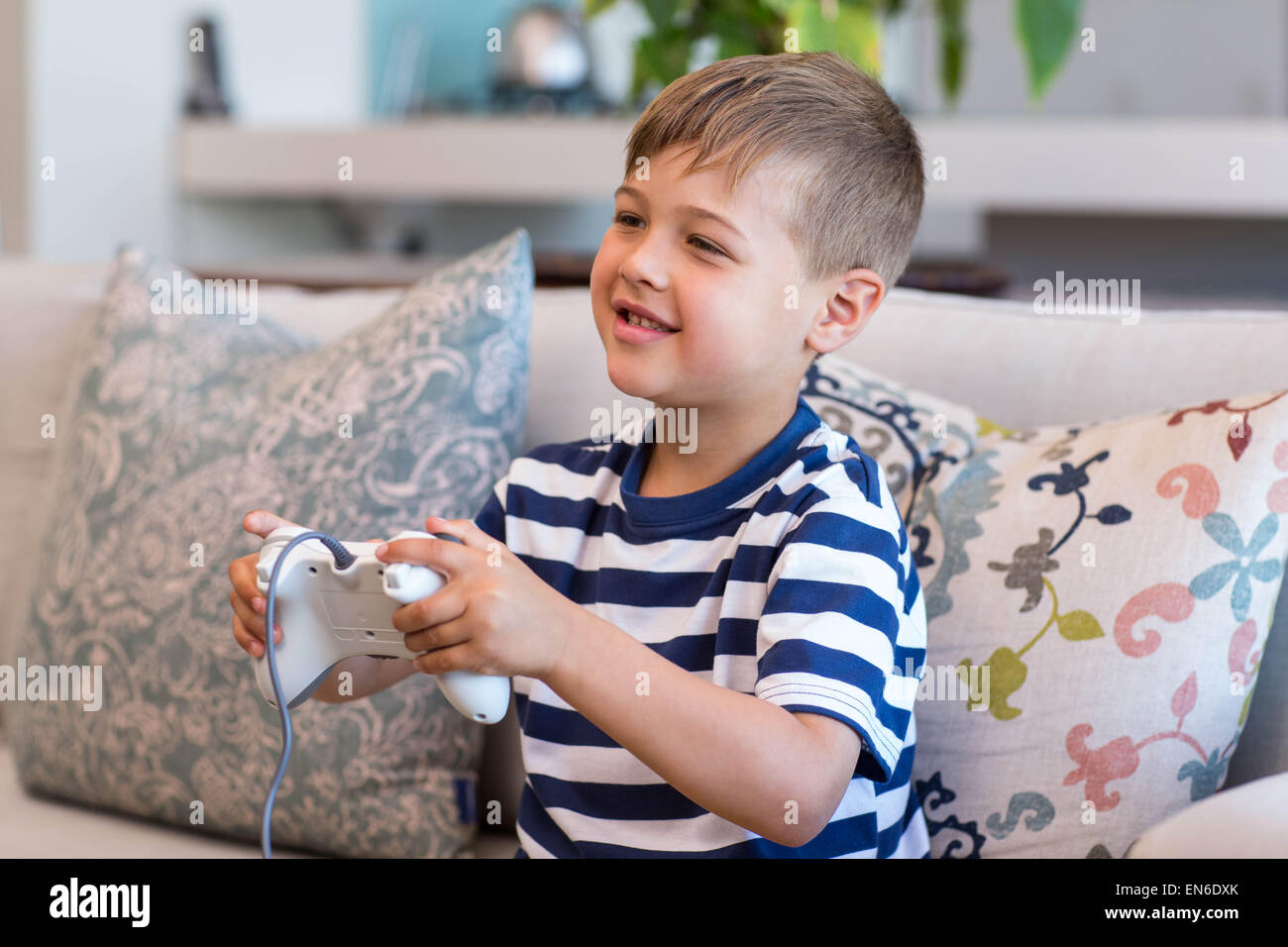 Two boys plays online games in quarantine. Young boys smile and use phone.  One look how play another Stock Photo - Alamy