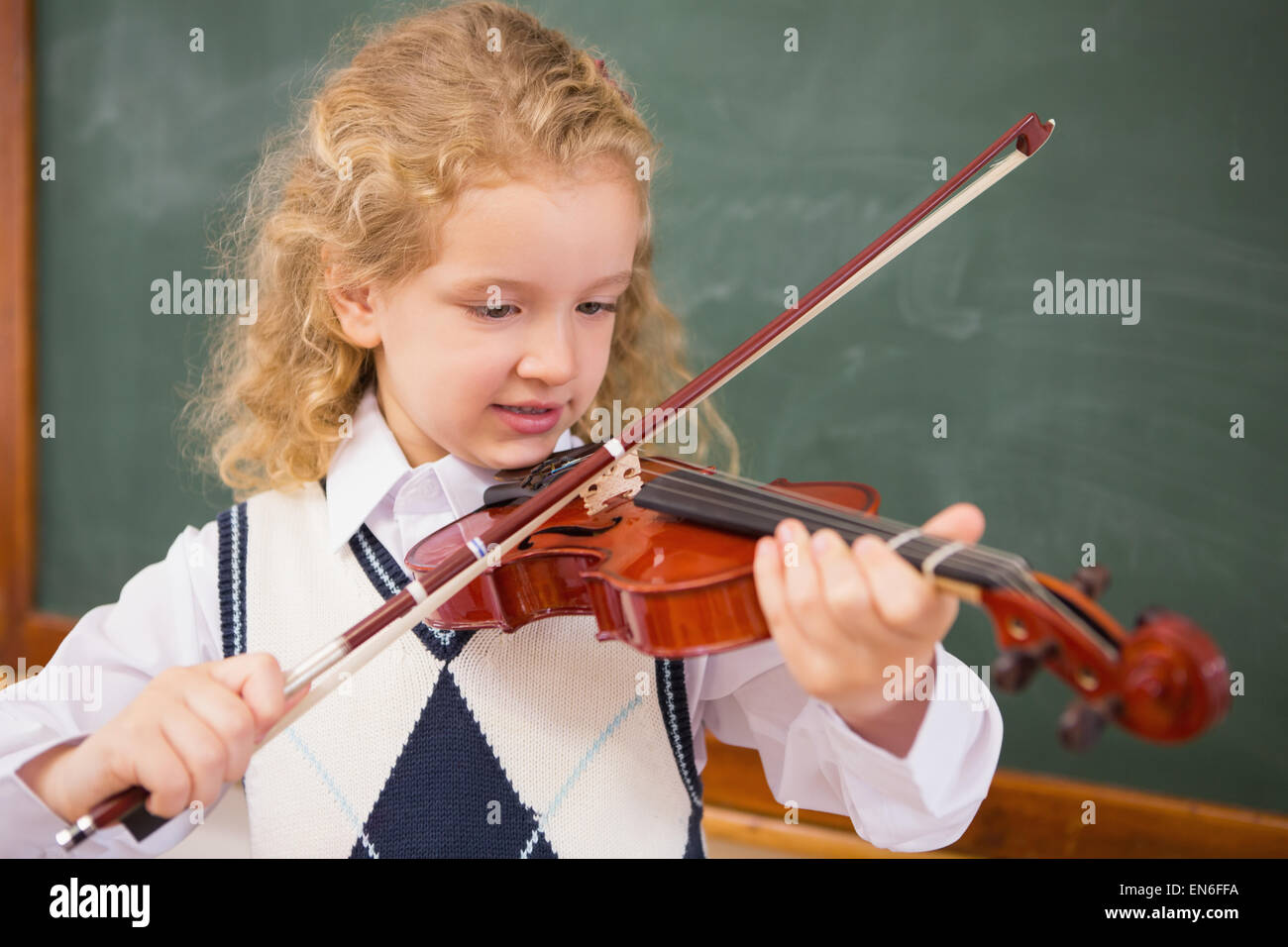 Cute pupil playing the violin Stock Photo