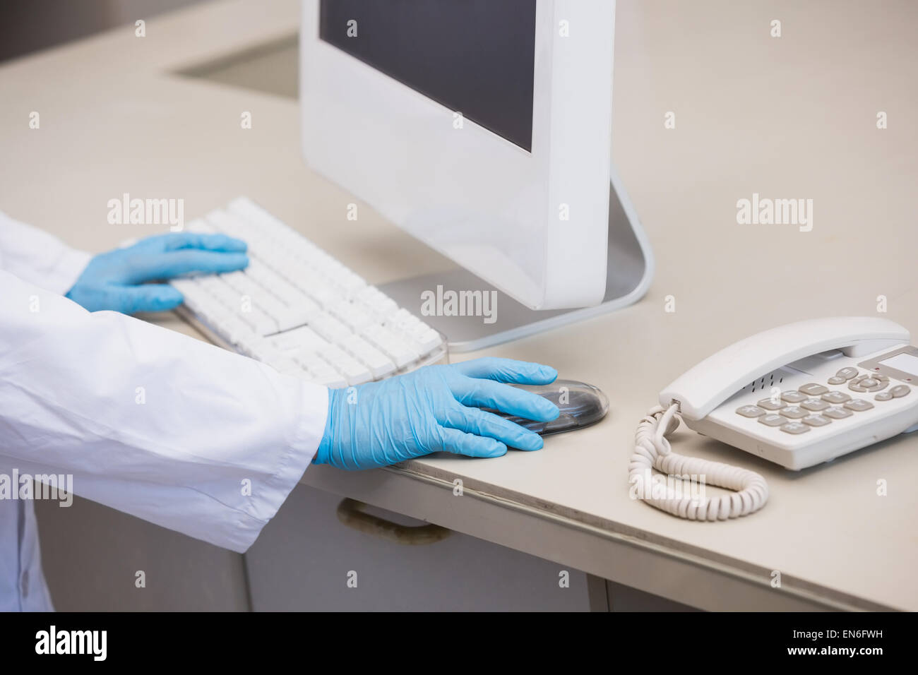 Scientist working with computer Stock Photo