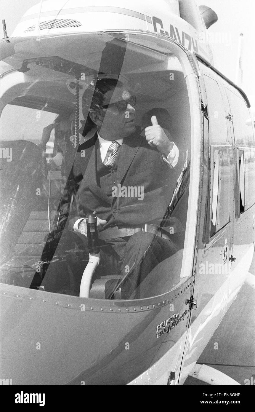 Singer Frank Sinatra who is in the United Kingdom to perform two charity concerts in aid of childrens charities. Is seen here in a Bell Jet Ranger helicopter at Gatwick Airport, shortly after arriving in his private jet. Sinatra took the short flight from Stock Photo